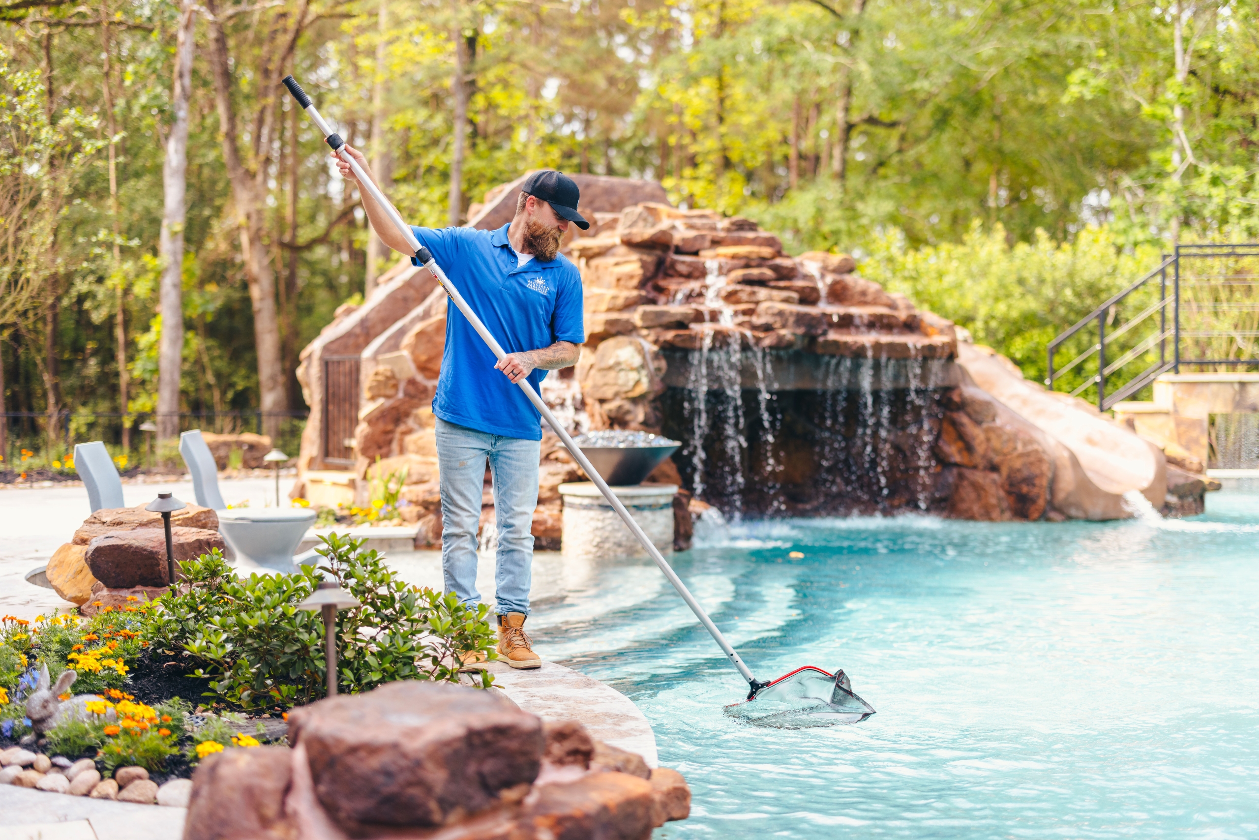 a person maintaining a swimming pool